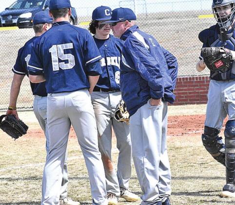LEFT: Coach Bobby Blackburn gives his team words of encouragement.