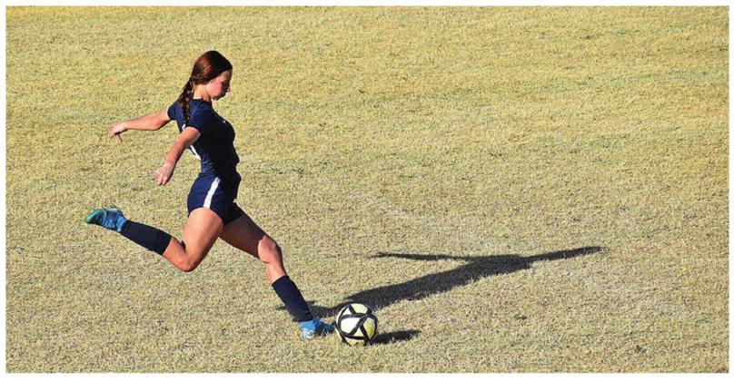 Erin Dudgeon boots the ball in a 7-2 loss to Chickasha