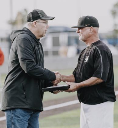 Right: Coach Blackburn (standing at right) is recognized for his leaderhip of th winning team