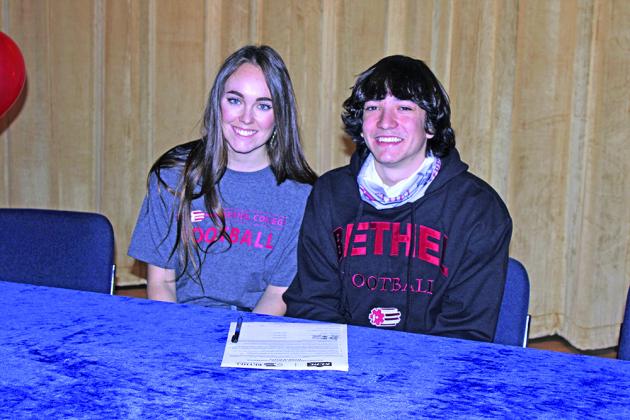 Raydon Kuehne poses for a picture with his sister Kaitlyn Kuehne.
