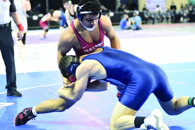 Cordell's Shane Perkins takes on Watonga's Joe Jackson in state wrestling.