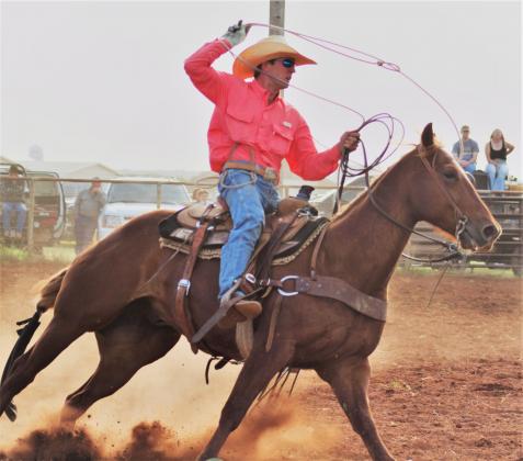 Ty Whitley prepares his lasso as he gets the steer in his sights. PHOTOS BY CARRIE WYATT