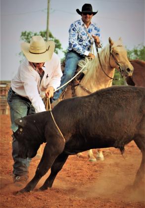 Jeremy &amp; Justin Weichel work together as they attempt to lasso their steer. PHOTOS BY CARRIE WYATT