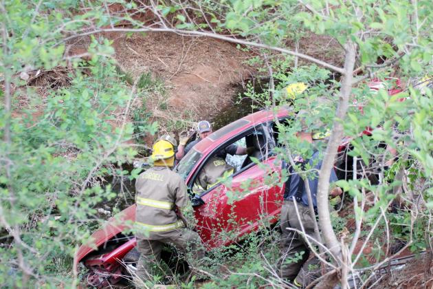 Mock scene: Fire crew assessing the vehicle and victim