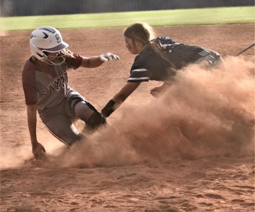 Kinsey Gray attempts an out against a Sayre player. Photo by Charlinda Ogle