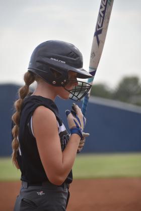 Emma Estes prepares to bat. Photo by Charlinda Ogle