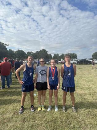 L-R: Jacob Vela, Coach Julie Horn, Calliy Walker, and Eathan Fenning