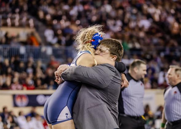 The bond between Baylor Moore and her coach, Jacolby Mitchell, is evident in celebrating her win - Photo by Anjelica Newcomer