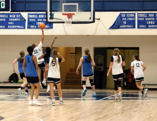 Lomega Raiders player #33 Aliana Lawson attempts to block Cordell Lady Blue Devil #33 Emma Holman’s shot. Other Cordell players include #5 Tralynn White, #1 Calliy Walker and #12 Kemper Woodis. Lomega players pictured are #5 Hadley Ott, #5 Bree Yost, and #20 Reagan Snowdan. Photo by Brooklynn Peek.