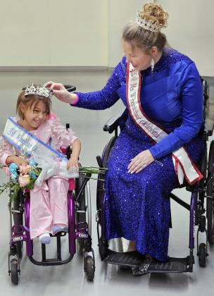 Ms. Wheelchair Oklahoma Erica Sebourn places a crown on Olivia's head, officially making her Oklahoma's Little Miss Wheelchair 2026.