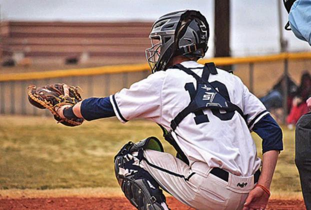 Catcher JD Maddox extends his arm to catch a strike. MIDDLE