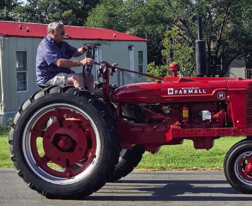 Parade participants County Commissioner District 1 Bart Gossen (left) and Ronnie McKee (above) wowed the crowd with their antique rides