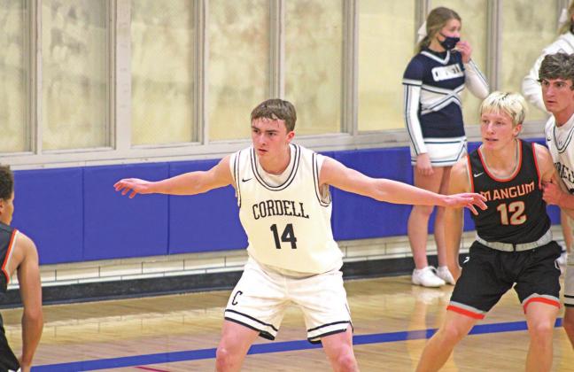 Bode Gallagher guards an ooppent during a basketball game against Mangum. PHOTO BY FLORA WALTERS