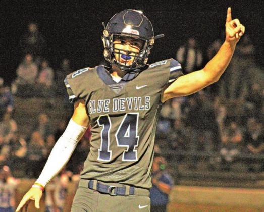 Bode Gallagher signals to his team during a football game earlier this year. PHOTO BY FLORA WALTERS