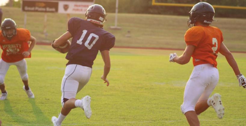 Blue Devil quarterback Raydon Kuehne sprints toward the endzone.