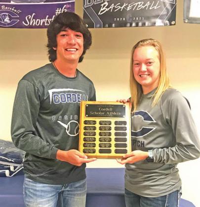 ABOVE: Scholar Athlete awards were presented to Raydon Kuehne and Andrea Palmer. BELOW: Supporter April Cochran presents each Senior athlete with a personalized embroidered blanket. CONTRIBUTED PHOTOS