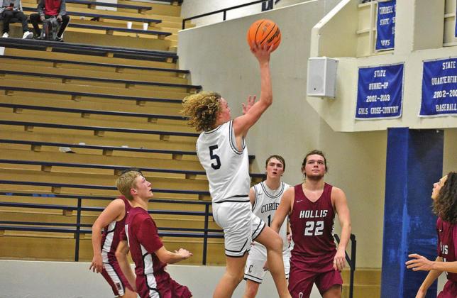 TOP LEFT: Kray Rogers goes up for two points in his team’s win over Hollis.