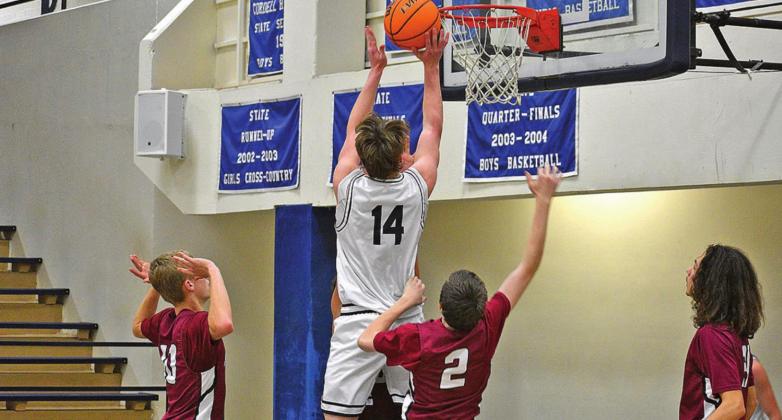 MIDDLE LEFT: Blaine Larsen dribbles the ball around a defender. BOTTOM LEFT: Bode Gallagher skies for two points.