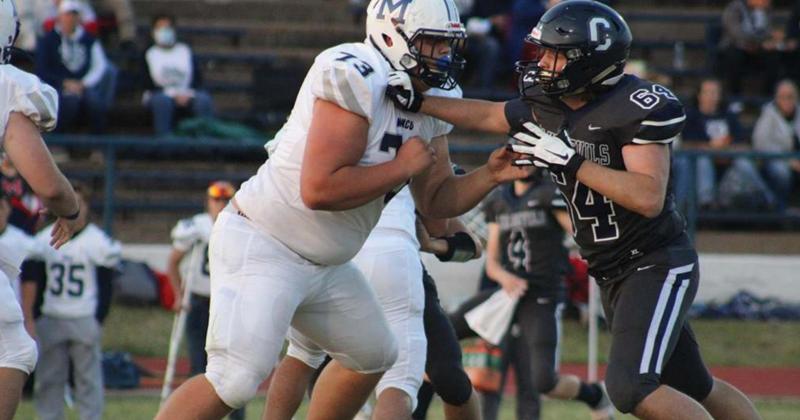 Cameron Cochran shoves his opponent.
