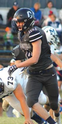 Bode Gallagher tosses an opponent onto the ground.