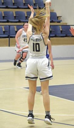 TOP: Shane Perkins makes a move to try and pin his opponent. ABOVE: Gavin Jasmer charges his opponent, knocking him off his feet. RIGHT: Taylor Javorsky sinks a perfect 3-pointer in the Lady Devils’ game against the BFDC Lady Eagles. PHOTOS BY FLORA WALTERS