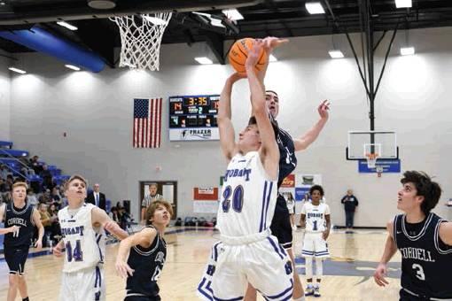 Cordell’s Bode Gallagher blocks a Hobart layup in Friday’s game. Photo courtesy of Todd Hancock | Hobart Democrat-Chief