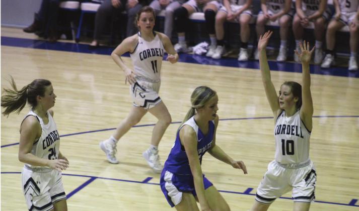 Left: Bailey Troub draws the file on a drive to the bucket. Top right: Andrea Palmer rushes to defend a shooter; middle right: Renee Javosky drives around a defender; bottom right: Kamdyn Davis and Kenlee Dodd rush on the defense while Renee Javosky cuts off the lane. Bob Henline | The Cordell Beacon