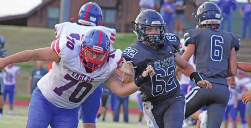 Cale McCoy pushes an opposing player