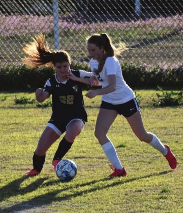 TOP: Renee Javorsky slides in to steal the ball. CONTRIBUTED PHOTOS BY CHARLINDA OGLE