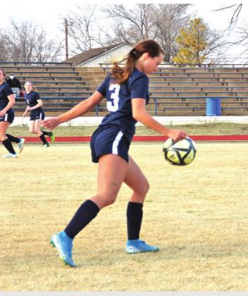 TOP: Brady Reimer makes a spectacular catch LEFT: Ava Willingham kicks the ball BOTTOM: Erin Dudgeon prepares for the kick CONTRIBUTED PHOTOS
