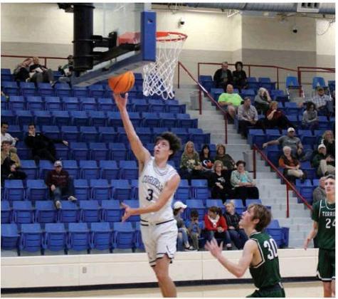 Above: Gaige Keister drives for a layup. Bottom left: Raydon Kuehne drives around a Thomas defender. Bottom right: Carsen Nickel slaps away a Thomas pass. Bob Henline | The Cordell Beacon.