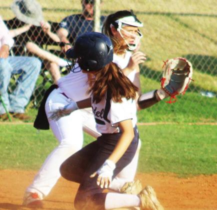Tatum King slides into third base.