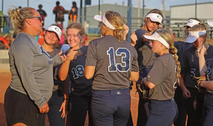Cordell Softball Girls gather around coach after the game against Snyder