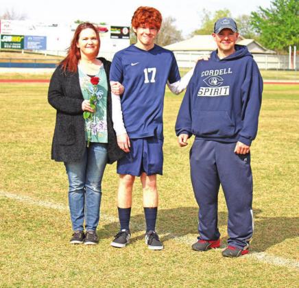 TOP: Spencer Williams with his mother Chasidy Holman and his father Justin Williams on soccer Senior Night. BELOW: Tugger Selman, Gavin Jasmer, and Spencer Williams gather for a picture after a soccer game. CONTRIBUTED PHOTOS