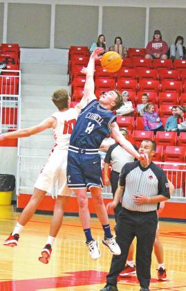 ABOVE: Senior Bode Gallagher slaps the ball back to his team, starting the game off on the right foot. LEFT: Cordell and Mangum players race for a potential rebound, but Ellie Willard sinks the free throw. PHOTOS BY FLORA A. WALTERS