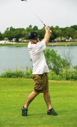 Kellon Hines also hitting his second shot on the par 4 Hole 12. Kellon teamed up with his brother Cameron and Brad Davis and Brent Walton of Ft.Cobb for the Play for Scott Tournament.