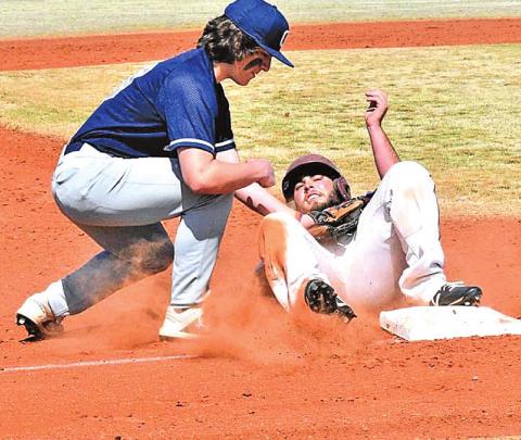 ABOVE: Raydon Kuehne successfully tags his opponent mid-slide. CONTRIBUTED PHOTOS BY CHARLINDA OGLE
