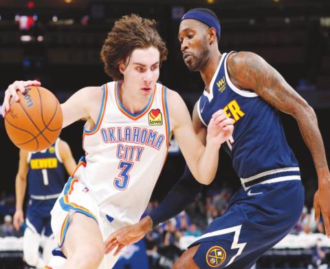 Oklahoma City Thunder guard Josh Giddey drives to the basket against Denver Nuggets forward Will Barton during the second half at Paycom Center. (Alonzo Adams-USA TODAY Sports)