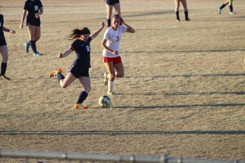 #12 Tristen Reimer sends the ball upfield to an open teammate in an attempt to score a goal. Photo by Brooklynn Peek 