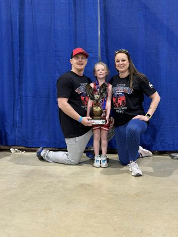 Preslie Dickerson poses with her third place trophy alongside her dad, Josh Dickerson and mom, Rachel Dickerson. PHOTO COURTESY OF RACHEL DICKERSON