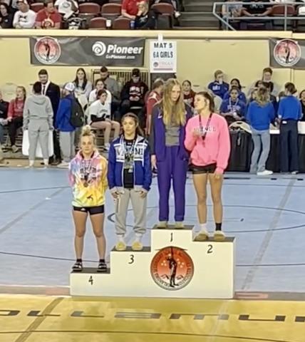 Baylor Moore standing in 4th on the podium