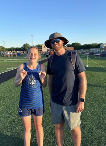 Courtesy photo of Calliy Walker next to Coach Love