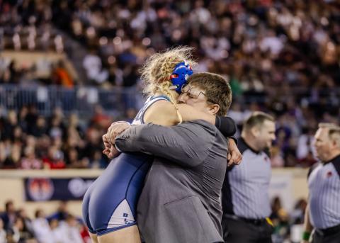 The bond between Baylor Moore and her coach, Jacolby Mitchell, is evident in celebrating her win - Photo by Anjelica Newcomer