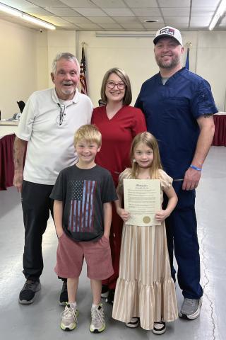 Accepting the Proclamation from Mayor Phil Kliewer on behalf of Lydia Hall’s family is Stephanie Suttles, alongside her husband Jason and their children Mason and Lillian
