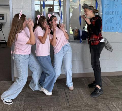 Chaynee Hunter, Olivia Christian, Chloe Smith, and Dakota Ivey as the Three Little Pigs and the Big Bad Wolf