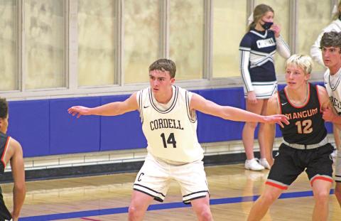 Bode Gallagher guards an ooppent during a basketball game against Mangum. PHOTO BY FLORA WALTERS