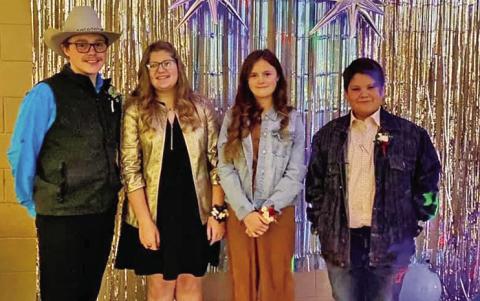 RIGHT: Rowdy Waugh, Kathryn Sirmon, Sage Waugh, and Braxton Barnett were all dressed up and ready to enjoy their evening at the 4-H Winter Formal.