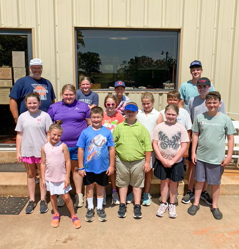 Front row L-R: Divya Rolens, Benaiah Miller, Josiah Miller, Isabella Huntzinger, Brantley Foust. Middle row L-R: Raegan Parsons, Rylee Davis, Brinkley Imboden, Elsie Jaronek, Tuff Gray, Everett Hunzinger. Back row L-R: Coach JJ Williams, Kaylor Calloway, Logan Hewitt, Jaxon Davis