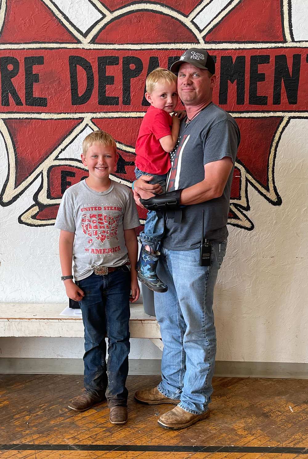 Nocona Cook alongside his two kids Denton and Baylor during the 103rd Annual Meeting of the Farmers Cooperative Exchange of Bessie-Cordell-Burns Flat. Cook was recognized at the meeting for being appointed to the Oklahoma Department of Agriculture board.