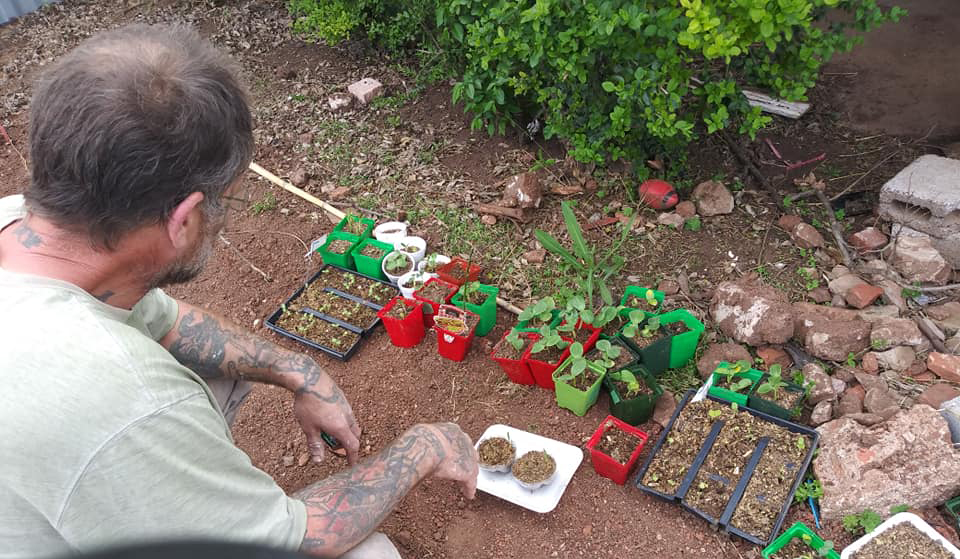 Chris Glasscock tending to his plants.